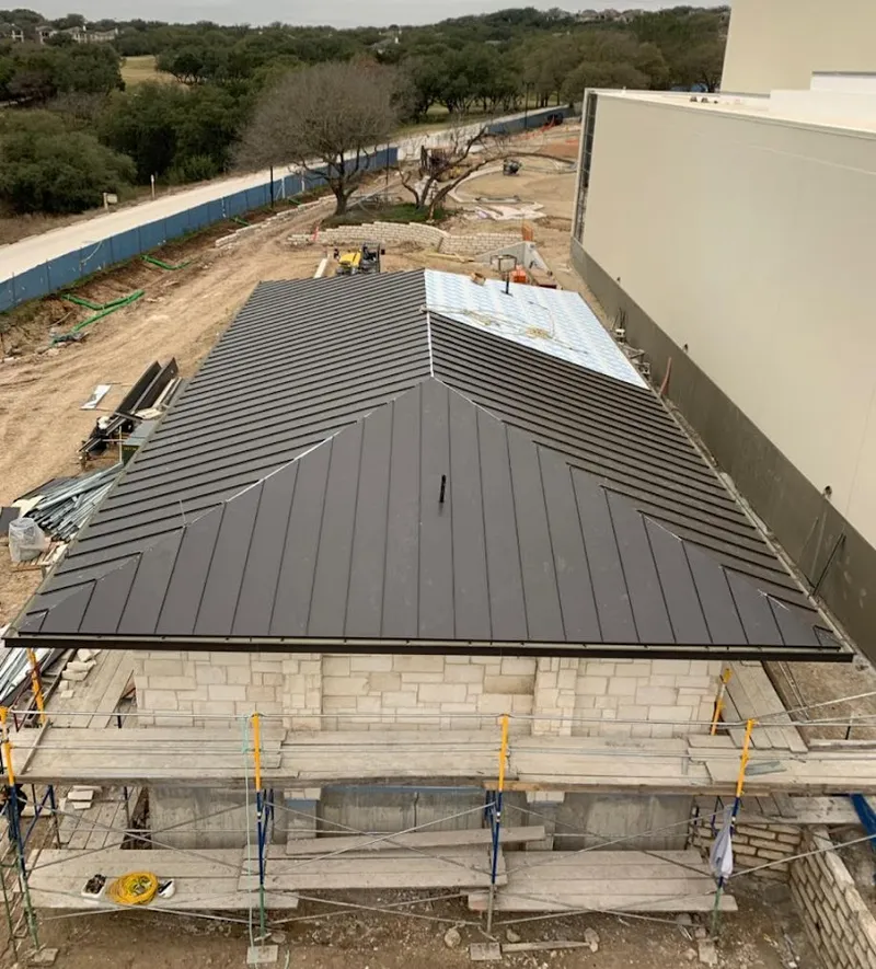 Metal roof new construction with scaffolding in Colville