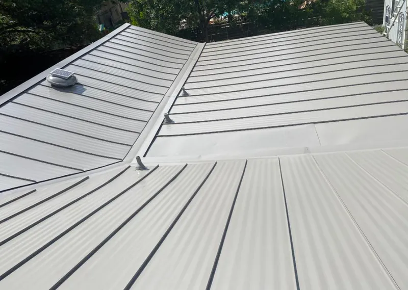 Solar attic fan installed on a metal roof for Roof Ventilation in Colville
